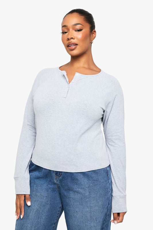 Soft jersey fabric with a relaxed, boxy silhouette for all-day comfort
        Classic Henley neckline with button placket detail adding a subtle stylish touch
        Long sleeves with neat cuffs perfect for transitional weather
        Versatile design that pairs effortlessly with jeans, trousers or skirts
        Inclusive plus sizing designed to flatter your curves with a comfortable fit
    
    This casual Henley top combines timeless style with everyday comfort. The boxy cut creates a relaxed silhouette that's perfect for your off-duty wardrobe, whilst the button placket adds just the right amount of interest to elevate it beyond a basic tee. Style it as seen with wide-leg denim for a contemporary casual look, or tuck the front into high-waisted trousers for a more defined shape. The versatile design makes it ideal for family gatherings, weekend brunches or casual Fridays at work. Layer under a denim jacket when the temperature drops or wear on its own with your favourite accessories. This Boohoo essential will quickly become your go-to for those days when you want to look put-together without sacrificing comfort.