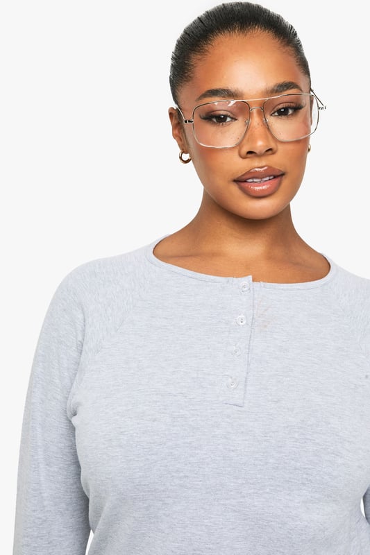Soft jersey fabric with a relaxed, boxy silhouette for all-day comfort
        Classic Henley neckline with button placket detail adding a subtle stylish touch
        Long sleeves with neat cuffs perfect for transitional weather
        Versatile design that pairs effortlessly with jeans, trousers or skirts
        Inclusive plus sizing designed to flatter your curves with a comfortable fit
    
    This casual Henley top combines timeless style with everyday comfort. The boxy cut creates a relaxed silhouette that's perfect for your off-duty wardrobe, whilst the button placket adds just the right amount of interest to elevate it beyond a basic tee. Style it as seen with wide-leg denim for a contemporary casual look, or tuck the front into high-waisted trousers for a more defined shape. The versatile design makes it ideal for family gatherings, weekend brunches or casual Fridays at work. Layer under a denim jacket when the temperature drops or wear on its own with your favourite accessories. This Boohoo essential will quickly become your go-to for those days when you want to look put-together without sacrificing comfort.