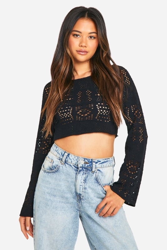 Intricate crochet-style pattern for a bold, eye-catching look
        Cropped length perfect for showcasing high-waisted bottoms
        Long sleeves with a slightly flared design
        Textured fabric adds depth and interest to the garment
        Versatile piece suitable for layering or wearing on its own
    
    This long-sleeved textured top is a must-have addition to your casual wardrobe. The intricate crochet-style pattern creates a captivating visual appeal, while the cropped silhouette adds a contemporary edge. Style it with high-waisted jeans and trainers for a laid-back daytime look, or pair it with a midi skirt and ankle boots for a chic evening ensemble. The versatility of this top makes it perfect for various casual occasions, from coffee dates to family gatherings. Layer it over a camisole on cooler days or wear it solo when the temperature rises. The slightly flared sleeves provide a subtle bohemian touch, making this top a standout piece that effortlessly combines comfort and style.