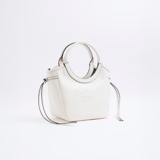 Faux leather fabric, Embossed branding, Side tie detail, Rounded handle, Popper fastening, Adjustable strap, Handle drop: 60cm, Bag dimensions: L: 20cm x D: 14cm x W: 22cmAbout the brandFASHION IS OUR DNARiver Island is an icon of the British high street. Inspired by the latest trends and our heritage style archives, we've been serving style and leading trends for over sixty years.We make fashion for real people with real lives, who want to look real good. Because life's a celebration - let's dress for it.