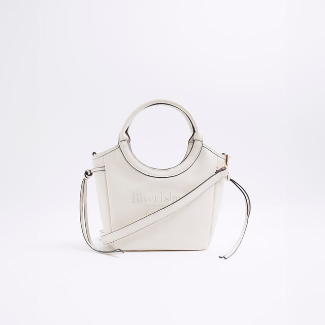 Faux leather fabric, Embossed branding, Side tie detail, Rounded handle, Popper fastening, Adjustable strap, Handle drop: 60cm, Bag dimensions: L: 20cm x D: 14cm x W: 22cmAbout the brandFASHION IS OUR DNARiver Island is an icon of the British high street. Inspired by the latest trends and our heritage style archives, we've been serving style and leading trends for over sixty years.We make fashion for real people with real lives, who want to look real good. Because life's a celebration - let's dress for it.