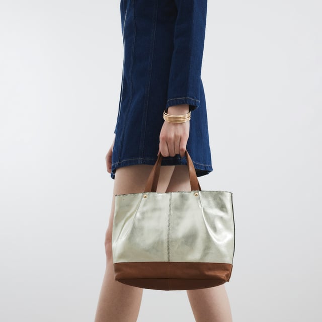 River Island Womens Gold Metallic Leather Shopper Bag Leather, Metallic, Grab handles, Interior zipped pocket, Popper fastening, Handle drop: 13cm, H: 22cm x W: 32cm x D: 9cmAbout the brandFASHION IS OUR DNARiver Island is an icon of the British high street. Inspired by the latest trends and our heritage style archives, we've been serving style and leading trends for over sixty years.We make fashion for real people with real lives, who want to look real good. Because life's a celebration - let's dress for it.
