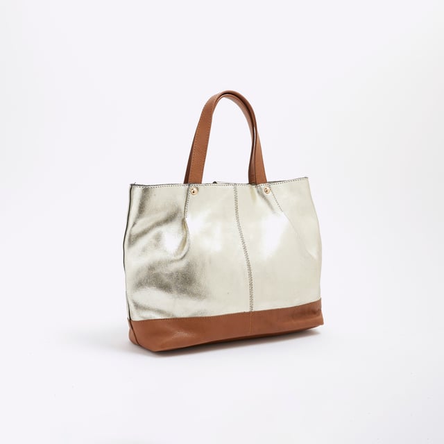 River Island Womens Gold Metallic Leather Shopper Bag Leather, Metallic, Grab handles, Interior zipped pocket, Popper fastening, Handle drop: 13cm, H: 22cm x W: 32cm x D: 9cmAbout the brandFASHION IS OUR DNARiver Island is an icon of the British high street. Inspired by the latest trends and our heritage style archives, we've been serving style and leading trends for over sixty years.We make fashion for real people with real lives, who want to look real good. Because life's a celebration - let's dress for it.