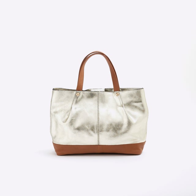 River Island Womens Gold Metallic Leather Shopper Bag Leather, Metallic, Grab handles, Interior zipped pocket, Popper fastening, Handle drop: 13cm, H: 22cm x W: 32cm x D: 9cmAbout the brandFASHION IS OUR DNARiver Island is an icon of the British high street. Inspired by the latest trends and our heritage style archives, we've been serving style and leading trends for over sixty years.We make fashion for real people with real lives, who want to look real good. Because life's a celebration - let's dress for it.