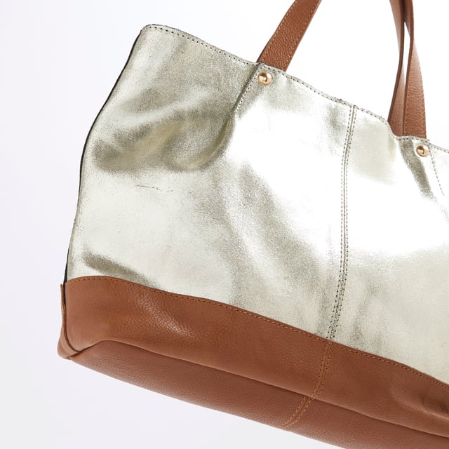 River Island Womens Gold Metallic Leather Shopper Bag Leather, Metallic, Grab handles, Interior zipped pocket, Popper fastening, Handle drop: 13cm, H: 22cm x W: 32cm x D: 9cmAbout the brandFASHION IS OUR DNARiver Island is an icon of the British high street. Inspired by the latest trends and our heritage style archives, we've been serving style and leading trends for over sixty years.We make fashion for real people with real lives, who want to look real good. Because life's a celebration - let's dress for it.