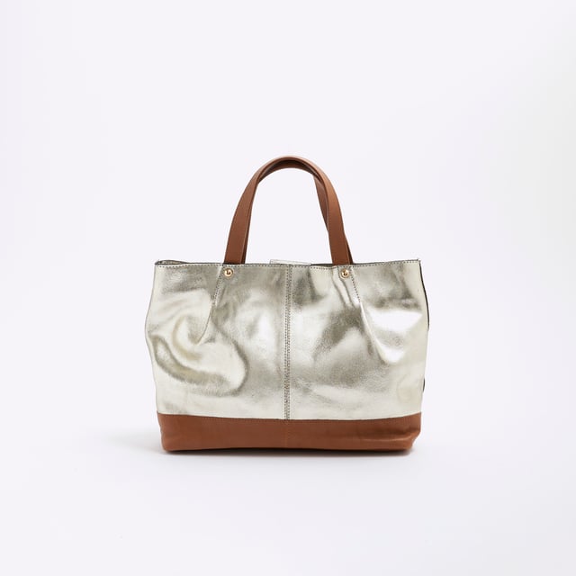 River Island Womens Gold Metallic Leather Shopper Bag Leather, Metallic, Grab handles, Interior zipped pocket, Popper fastening, Handle drop: 13cm, H: 22cm x W: 32cm x D: 9cmAbout the brandFASHION IS OUR DNARiver Island is an icon of the British high street. Inspired by the latest trends and our heritage style archives, we've been serving style and leading trends for over sixty years.We make fashion for real people with real lives, who want to look real good. Because life's a celebration - let's dress for it.