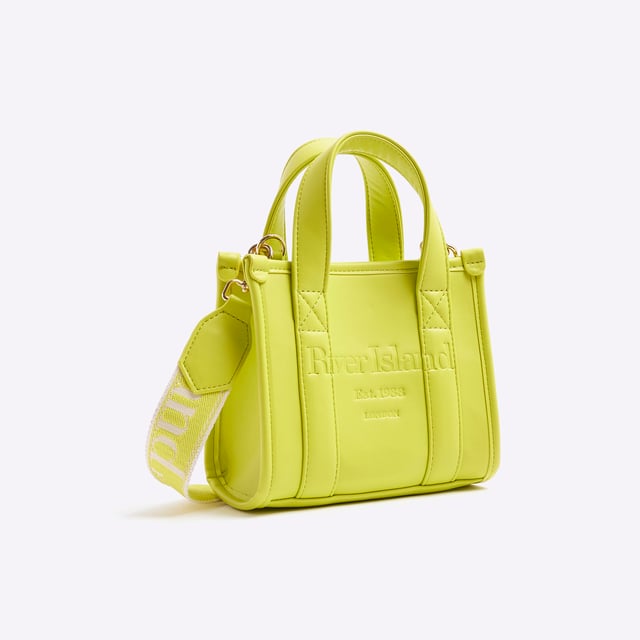River Island Womens Lime Mini Embossed Tote Bag Faux leather, Grab top handles, Embossed branding, Detachable branded cross body strap, Popper fastening, W 18cm x D 9cmAbout the brandFASHION IS OUR DNARiver Island is an icon of the British high street. Inspired by the latest trends and our heritage style archives, we've been serving style and leading trends for over sixty years.We make fashion for real people with real lives, who want to look real good. Because life's a celebration - let's dress for it.
