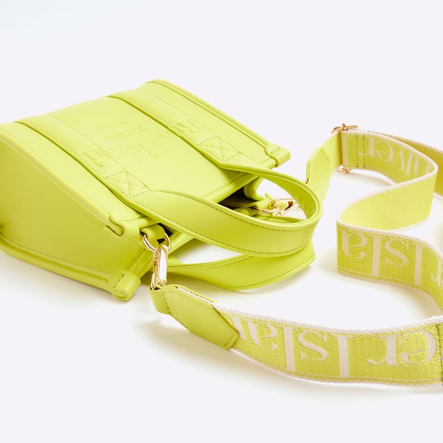 River Island Womens Lime Mini Embossed Tote Bag Faux leather, Grab top handles, Embossed branding, Detachable branded cross body strap, Popper fastening, W 18cm x D 9cmAbout the brandFASHION IS OUR DNARiver Island is an icon of the British high street. Inspired by the latest trends and our heritage style archives, we've been serving style and leading trends for over sixty years.We make fashion for real people with real lives, who want to look real good. Because life's a celebration - let's dress for it.