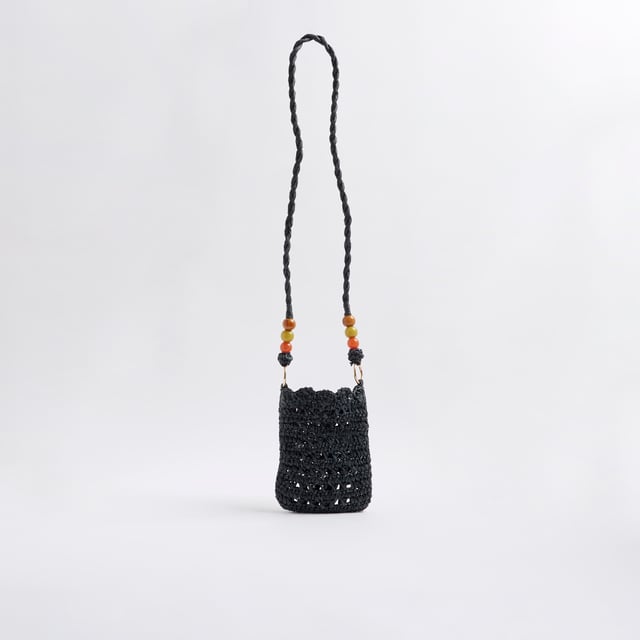 River Island Womens Black Raffia Beaded Cross Body Phone Bag Raffia, Cross body strap, Beaded detail, Strap drop: 50cm, Bag dimensions: H: 18cm x W: 13cm x D: 2cmAbout the brandFASHION IS OUR DNARiver Island is an icon of the British high street. Inspired by the latest trends and our heritage style archives, we've been serving style and leading trends for over sixty years.We make fashion for real people with real lives, who want to look real good. Because life's a celebration - let's dress for it.