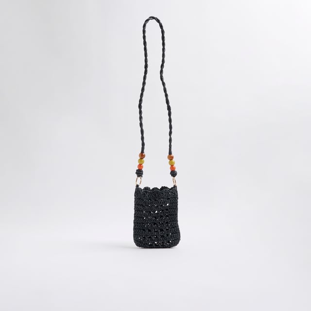 River Island Womens Black Raffia Beaded Cross Body Phone Bag Raffia, Cross body strap, Beaded detail, Strap drop: 50cm, Bag dimensions: H: 18cm x W: 13cm x D: 2cmAbout the brandFASHION IS OUR DNARiver Island is an icon of the British high street. Inspired by the latest trends and our heritage style archives, we've been serving style and leading trends for over sixty years.We make fashion for real people with real lives, who want to look real good. Because life's a celebration - let's dress for it.