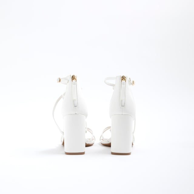 River Island Womens Sandals White Strappy Block Heel Block heel, Round open toe, Strappy style, Buckle fastening, Zip detail, Heel height: 6cmAbout the brandFASHION IS OUR DNARiver Island is an icon of the British high street. Inspired by the latest trends and our heritage style archives, we've been serving style and leading trends for over sixty years.We make fashion for real people with real lives, who want to look real good. Because life's a celebration - let's dress for it.