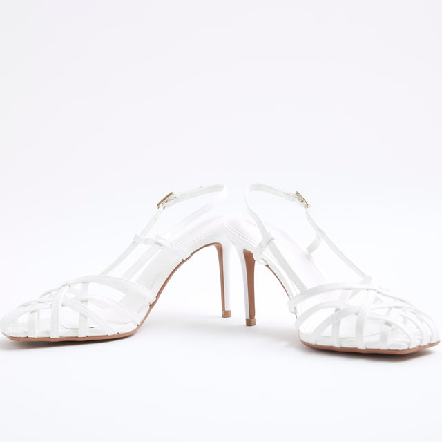 Square toe, Skinny heel, Caged design, Ankle strapped, Buckle fastening, Heel height: 8cmAbout the brandFASHION IS OUR DNARiver Island is an icon of the British high street. Inspired by the latest trends and our heritage style archives, we've been serving style and leading trends for over sixty years.We make fashion for real people with real lives, who want to look real good. Because life's a celebration - let's dress for it.