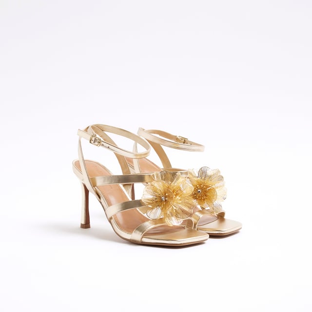 Faux leather fabric, Cross strapped, Flower trim, Open toe, Backless, Skinny heeled, Heel height: 6cmAbout the brandFASHION IS OUR DNARiver Island is an icon of the British high street. Inspired by the latest trends and our heritage style archives, we've been serving style and leading trends for over sixty years.We make fashion for real people with real lives, who want to look real good. Because life's a celebration - let's dress for it.