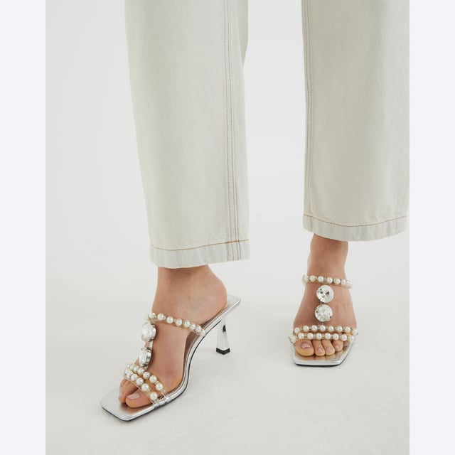 River Island Womens Sandals Silver Pearl Diamante Heeled Faux leather fabric, Pearl detail, Diamante detail, Open toe, Backless, Skinny heels, Heel height: 6cmAbout the brandFASHION IS OUR DNARiver Island is an icon of the British high street. Inspired by the latest trends and our heritage style archives, we've been serving style and leading trends for over sixty years.We make fashion for real people with real lives, who want to look real good. Because life's a celebration - let's dress for it.
