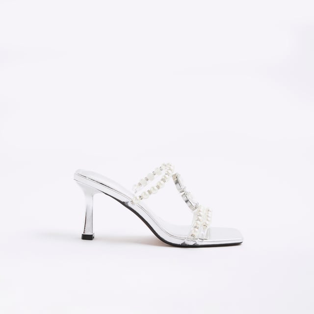 River Island Womens Sandals Silver Pearl Diamante Heeled Faux leather fabric, Pearl detail, Diamante detail, Open toe, Backless, Skinny heels, Heel height: 6cmAbout the brandFASHION IS OUR DNARiver Island is an icon of the British high street. Inspired by the latest trends and our heritage style archives, we've been serving style and leading trends for over sixty years.We make fashion for real people with real lives, who want to look real good. Because life's a celebration - let's dress for it.