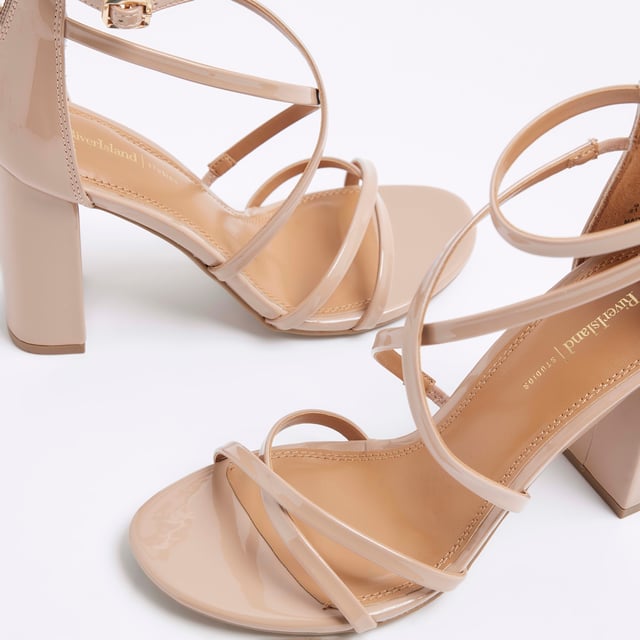 Patent fabric, Strappy detail, Zipped fastening, Open toe, Block heeled, Heel height: 6cmAbout the brandFASHION IS OUR DNARiver Island is an icon of the British high street. Inspired by the latest trends and our heritage style archives, we've been serving style and leading trends for over sixty years.We make fashion for real people with real lives, who want to look real good. Because life's a celebration - let's dress for it.