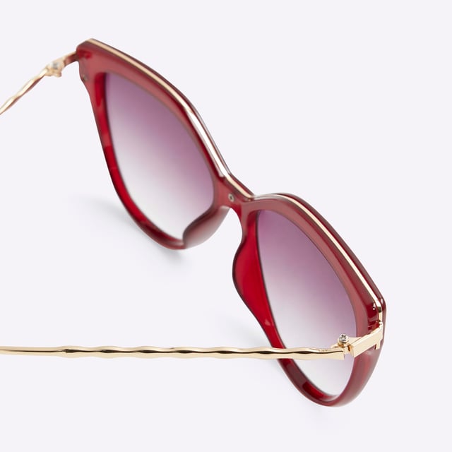 River Island Womens Red Cat Eye Gold Arm Sunglasses Cat eye shaped, Metal framed, Gold arm, Tinted lensesAbout the brandFASHION IS OUR DNARiver Island is an icon of the British high street. Inspired by the latest trends and our heritage style archives, we've been serving style and leading trends for over sixty years.We make fashion for real people with real lives, who want to look real good. Because life's a celebration - let's dress for it.