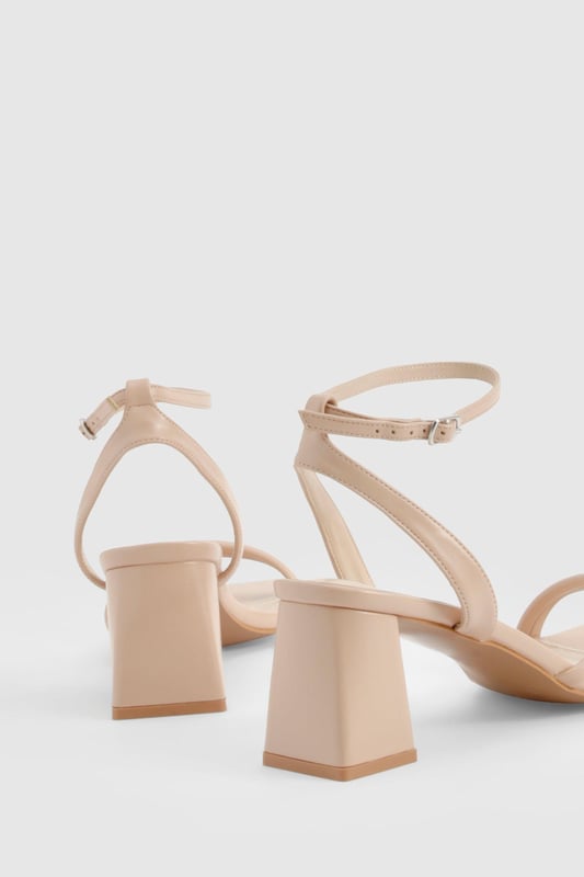 Look cute and feel comfy in these wide fit heels that will last you from boozy brunch all the way to bedtime, without the sore feet. They're designed to provide more room for the foot, and they have a wider tread on the sole, so they'll be super comfortable for you to make moves and serve looks, no matter what the occasion. You can wave goodbye to sore feet and say hello to a great night out. We're loving gold wide fit heels this party season teamed with a simple black midi - beaut.Style: 2 Part HeelsFabric: PU