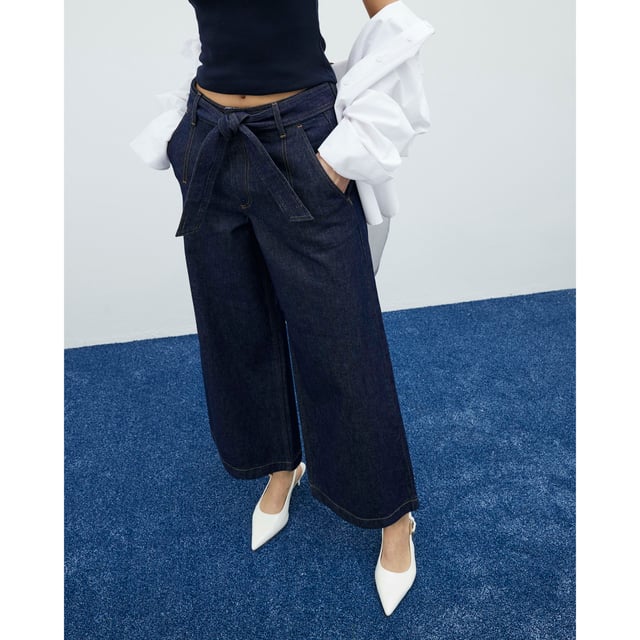 River Island Womens Cropped Jeans Indigo Belted Wide Leg Denim fabric, Cropped, Wide leg, Belted, Belt loops, Side slip pockets, Button and zipped fasteningAbout the brandFASHION IS OUR DNARiver Island is an icon of the British high street. Inspired by the latest trends and our heritage style archives, we've been serving style and leading trends for over sixty years.We make fashion for real people with real lives, who want to look real good. Because life's a celebration - let's dress for it.