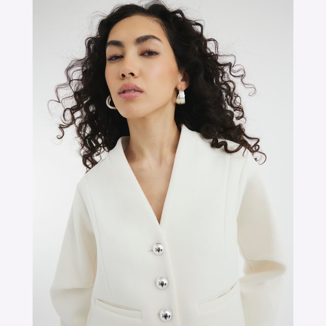 River Island Womens Jacket Cream Collarless Button Up V neck, Single Breasted, Collarless, Buttoned fastening, Long sleevedAbout the brandFASHION IS OUR DNARiver Island is an icon of the British high street. Inspired by the latest trends and our heritage style archives, we've been serving style and leading trends for over sixty years.We make fashion for real people with real lives, who want to look real good. Because life's a celebration - let's dress for it.