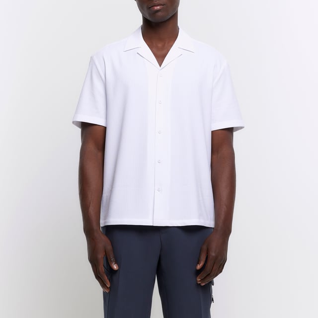 Regular fit, Seersucker fabric, Revere collar, Short sleeves, Button fasteningAbout the brandFASHION IS OUR DNARiver Island is an icon of the British high street. Inspired by the latest trends and our heritage style archives, we've been serving style and leading trends for over sixty years.We make fashion for real people with real lives, who want to look real good. Because life's a celebration - let's dress for it.