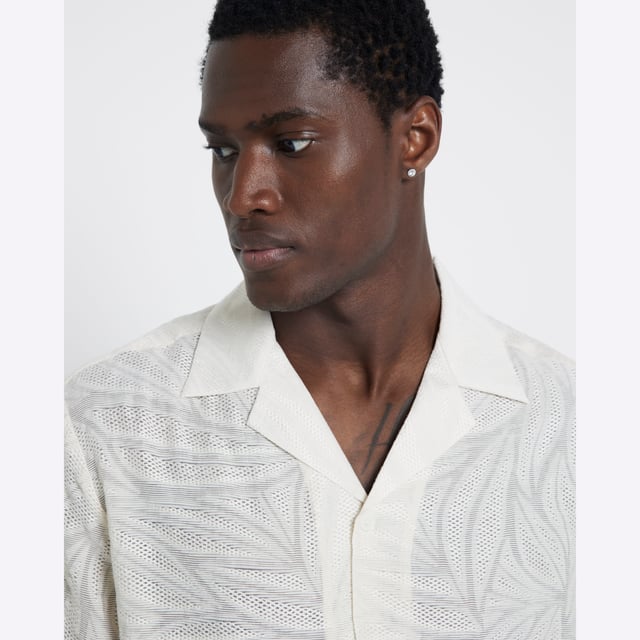 Jacquard textured, Collared, Buttoned fastening, Floral detail, Short sleevesAbout the brandFASHION IS OUR DNARiver Island is an icon of the British high street. Inspired by the latest trends and our heritage style archives, we've been serving style and leading trends for over sixty years.We make fashion for real people with real lives, who want to look real good. Because life's a celebration - let's dress for it.