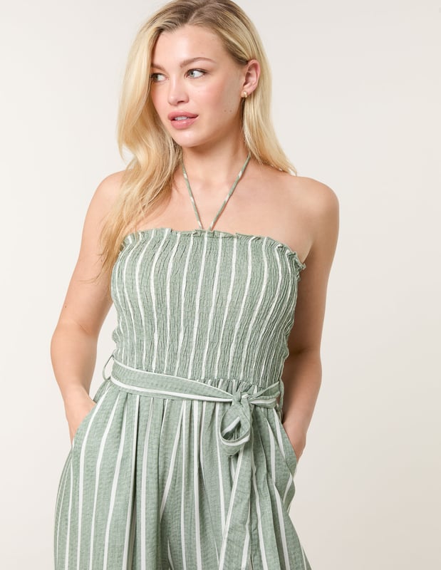 A timeless addition to your wardrobe, perfectly teamed with woven sandals, making this pinstripe jumpsuit a sustainable clothing choice that will stand the test of time.