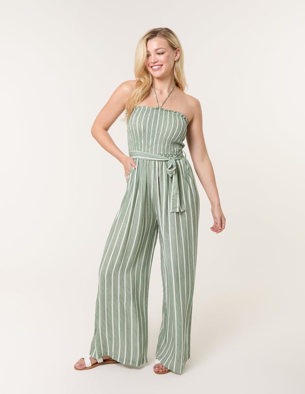 A timeless addition to your wardrobe, perfectly teamed with woven sandals, making this pinstripe jumpsuit a sustainable clothing choice that will stand the test of time.