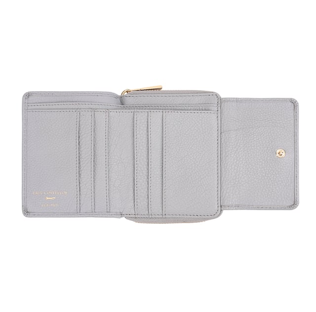 Crafted from soft leather, this elegant purse is designed for both style and function, featuring twin coin sections for easy access and separation. It offers ample card slots, a dedicated note section, and a clear card/ID display window for added convenience. Finished with a sleek brand logo plate on the front, it comes beautifully packaged in a gift box-perfect for yourself or someone special. D:3.4cm W:12.3cm H:9.7cm