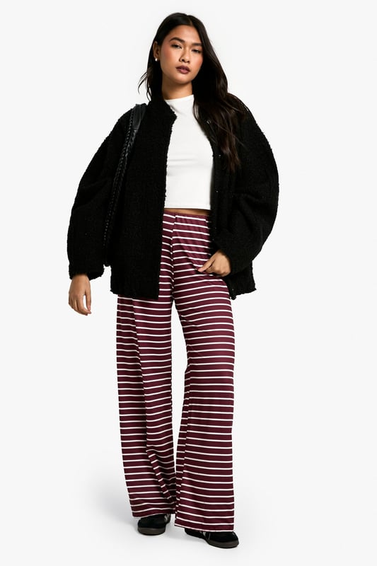 Striking horizontal stripe pattern
        High-waisted design for a flattering silhouette
        Wide-leg cut for maximum comfort and style
        Soft, stretchy fabric for all-day wear
        Versatile piece suitable for various casual occasions
    
    Make a bold statement with these eye-catching striped trousers from Boohoo. The wide-leg cut and high-waisted design create a lengthening effect, perfect for all body types. The soft, stretchy fabric ensures comfort without compromising on style, making these trousers ideal for long days out or relaxed evenings in. Pair them with a crisp white tee and oversized cardigan for a chic, laid-back look. For a more polished ensemble, team with a fitted blazer and ankle boots. These trousers are a versatile addition to your wardrobe, suitable for family gatherings, brunch dates, or casual Fridays at the office. The horizontal stripes add a playful touch to your outfit, allowing you to express your fun-loving personality whilst staying on-trend. Embrace the comfort and style of these must-have trousers that effortlessly blend fashion-forward design with everyday wearability.