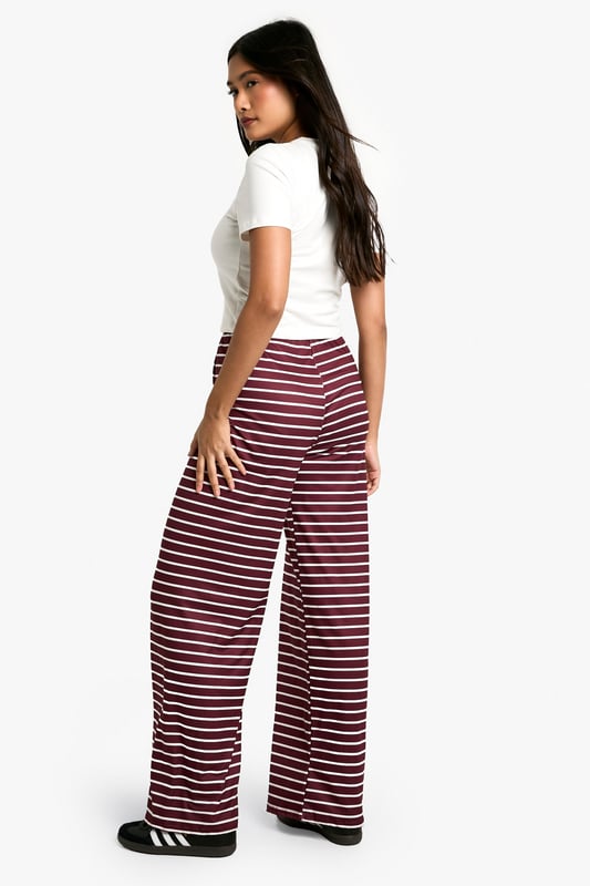 Striking horizontal stripe pattern
        High-waisted design for a flattering silhouette
        Wide-leg cut for maximum comfort and style
        Soft, stretchy fabric for all-day wear
        Versatile piece suitable for various casual occasions
    
    Make a bold statement with these eye-catching striped trousers from Boohoo. The wide-leg cut and high-waisted design create a lengthening effect, perfect for all body types. The soft, stretchy fabric ensures comfort without compromising on style, making these trousers ideal for long days out or relaxed evenings in. Pair them with a crisp white tee and oversized cardigan for a chic, laid-back look. For a more polished ensemble, team with a fitted blazer and ankle boots. These trousers are a versatile addition to your wardrobe, suitable for family gatherings, brunch dates, or casual Fridays at the office. The horizontal stripes add a playful touch to your outfit, allowing you to express your fun-loving personality whilst staying on-trend. Embrace the comfort and style of these must-have trousers that effortlessly blend fashion-forward design with everyday wearability.