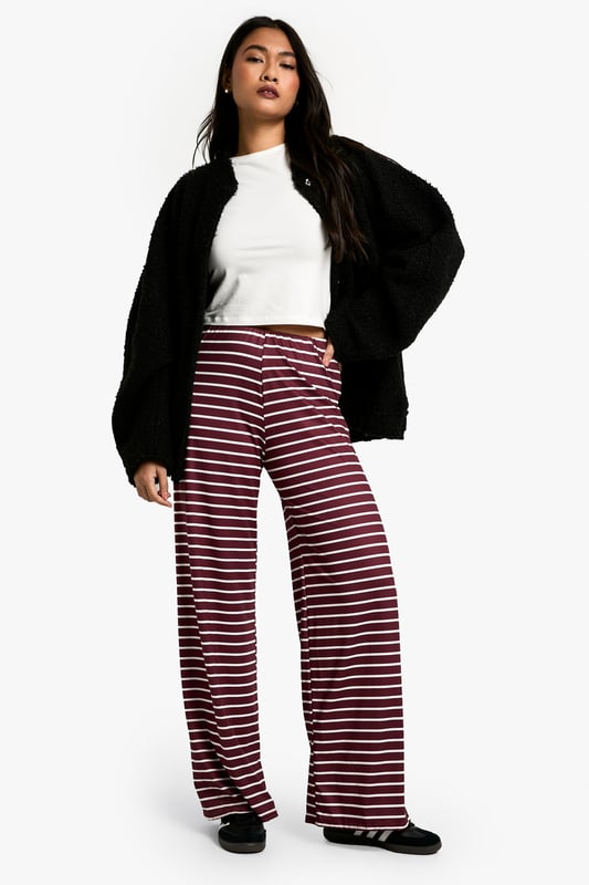 Striking horizontal stripe pattern
        High-waisted design for a flattering silhouette
        Wide-leg cut for maximum comfort and style
        Soft, stretchy fabric for all-day wear
        Versatile piece suitable for various casual occasions
    
    Make a bold statement with these eye-catching striped trousers from Boohoo. The wide-leg cut and high-waisted design create a lengthening effect, perfect for all body types. The soft, stretchy fabric ensures comfort without compromising on style, making these trousers ideal for long days out or relaxed evenings in. Pair them with a crisp white tee and oversized cardigan for a chic, laid-back look. For a more polished ensemble, team with a fitted blazer and ankle boots. These trousers are a versatile addition to your wardrobe, suitable for family gatherings, brunch dates, or casual Fridays at the office. The horizontal stripes add a playful touch to your outfit, allowing you to express your fun-loving personality whilst staying on-trend. Embrace the comfort and style of these must-have trousers that effortlessly blend fashion-forward design with everyday wearability.