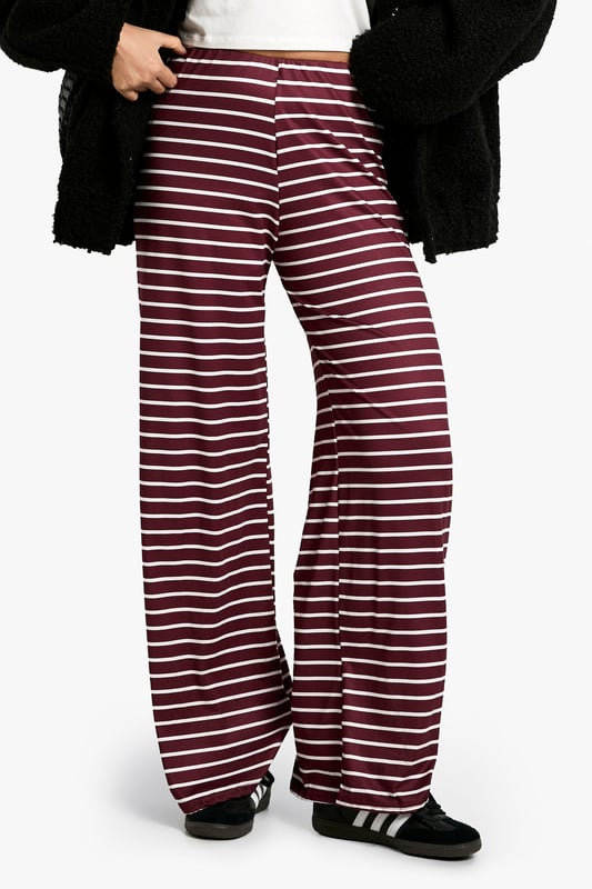 Striking horizontal stripe pattern
        High-waisted design for a flattering silhouette
        Wide-leg cut for maximum comfort and style
        Soft, stretchy fabric for all-day wear
        Versatile piece suitable for various casual occasions
    
    Make a bold statement with these eye-catching striped trousers from Boohoo. The wide-leg cut and high-waisted design create a lengthening effect, perfect for all body types. The soft, stretchy fabric ensures comfort without compromising on style, making these trousers ideal for long days out or relaxed evenings in. Pair them with a crisp white tee and oversized cardigan for a chic, laid-back look. For a more polished ensemble, team with a fitted blazer and ankle boots. These trousers are a versatile addition to your wardrobe, suitable for family gatherings, brunch dates, or casual Fridays at the office. The horizontal stripes add a playful touch to your outfit, allowing you to express your fun-loving personality whilst staying on-trend. Embrace the comfort and style of these must-have trousers that effortlessly blend fashion-forward design with everyday wearability.