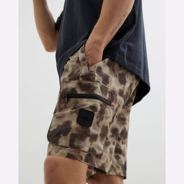 Camouflage print, Utility zipped pockets, Side and back slip pockets, Buttoned and zipped fastening, Elasticated drawstring waistAbout the brandFASHION IS OUR DNARiver Island is an icon of the British high street. Inspired by the latest trends and our heritage style archives, we've been serving style and leading trends for over sixty years.We make fashion for real people with real lives, who want to look real good. Because life's a celebration - let's dress for it.