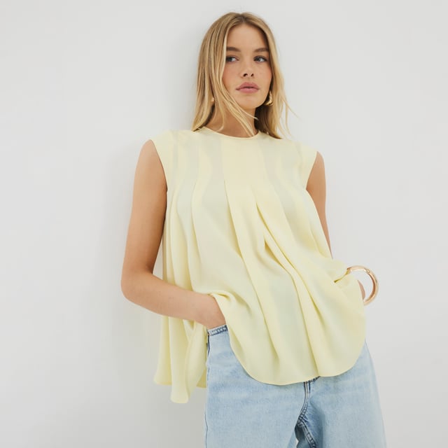 Round neckline, Sleeveless, Pleated, Button fasteningAbout the brandFASHION IS OUR DNARiver Island is an icon of the British high street. Inspired by the latest trends and our heritage style archives, we've been serving style and leading trends for over sixty years.We make fashion for real people with real lives, who want to look real good. Because life's a celebration - let's dress for it.