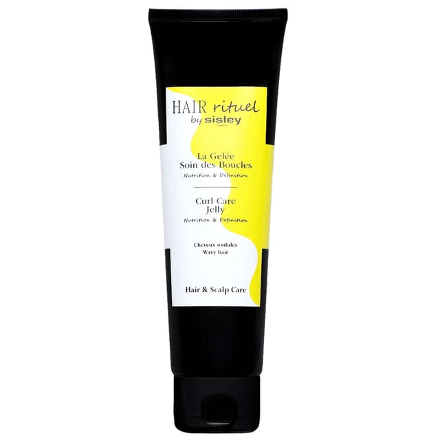 Discover the transformative power of Sisley's Hair Rituel Curl Care Jelly, designed for wavy hair types 2A to 2C. This luxurious treatment nourishes and defines curls while providing long-lasting hold. Infused with nourishing vegetable oils like Coconut, Shea, and Moringa, it enhances the natural beauty of your waves, leaving them glossy, soft, and bouncy. For best results, apply to damp hair and scrunch before air drying. Experience beautifully resilient curls with ease!