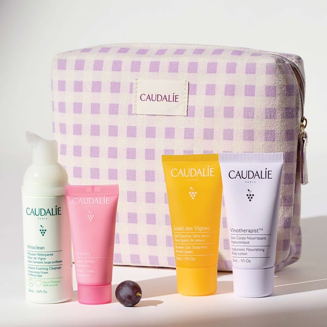 Discover essential skincare for your summer adventures with the Caudalie VinoHydra Summer Travel Skincare Set. This limited edition collection comes in a stylish pouch, perfect for beach trips or city escapes. Inside, you'll find the lightweight Vinoclean Foaming Cleanser (50ml), refreshing Vinohydra Sorbet Moisturiser (15ml), Soleil Des Vignes Shower Gel (30ml), and nourishing Vinotherapist Body Lotion (30ml). Each product cleanses, hydrates, and pampers your skin, while supporting Caudalie's commitment to sustainability.