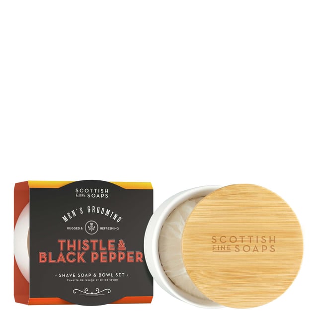 Experience the essence of Scotland with the Thistle & Black Pepper Shave Soap and Bowl Set from The Scottish Fine Soaps Company. This luxurious 100g shave soap features a rich, creamy texture infused with invigorating thistle and black pepper scents. Enriched with safflower oil, it moisturizes your skin while softening facial hair for a close shave. The set includes a reusable ceramic bowl with a bamboo lid, making it a perfect addition to your grooming routine. For best results, create a rich lather using a quality shaving brush.