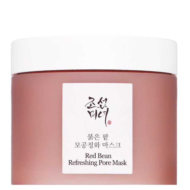 Experience the transformative power of the Beauty of Joseon Red Bean Refreshing Pore Mask. This 140ml mask is expertly designed to clear pores, absorb excess sebum, and refine skin texture, providing a flawless canvas for your beauty regimen. Enriched with Kaolin and 30% Haenum Red Bean Extract, it gently exfoliates, hydrates, and minimizes the appearance of pores, resulting in a balanced, radiant complexion. Suitable for all skin types, including oily and sensitive, this cruelty-free and vegan-friendly formula is a must-have for your skincare routine.