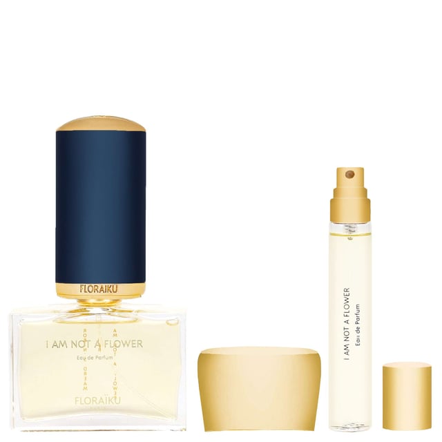 Floraiku I Am Not A Flower Eau de Parfum Spray Gift Set - Exquisite Fragrance Collection Discover the enchanting Floraiku I Am Not A Flower Eau de Parfum Spray Gift Set, a captivating fragrance experience designed for those who embrace their unique essence. This luxurious set features a 50ml Eau de Parfum and a convenient 10ml travel spray, perfect for on-the-go elegance. The scent opens with vibrant Ginger extract and smoky Incense, leading into a heart of sweet Ylang Ylang and rich Cedarwood, and finishing with a base of creamy Sandalwood and earthy Vetiver. Elevate your fragrance collection with this exquisite gift set, ideal for gifting or personal indulgence.