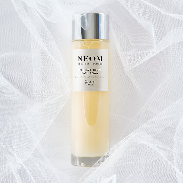 Experience the transformative power of Neom Wellbeing London Scent To Sleep Bedtime Hero Bath Foam, designed to enhance relaxation and promote restful sleep. This luxurious bath foam features a blend of 11 essential oils, including calming English lavender and soothing chamomile. Infused with nourishing marshmallow, coconut oil, sweet almond, and aloe, it softens your skin. Pour a capful under running water, soak for at least 10 minutes, and enjoy the calming scents. Ideal for creating a pre-sleep sanctuary, Neom is a Certified B Corporation committed to ethical practices and sustainability.