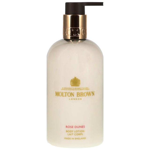 Indulge your skin with the Molton Brown Rose Dunes Body Lotion, a luxurious moisturizer that envelops your body in a tantalizing and warming fragrance. Experience the essence of a warm desert wind with the captivating notes of saffron and cassis at the top. The heart reveals tender rose notes beautifully entwined with geranium, while the base offers a deep and opulent oudh finish. This body lotion not only nourishes your skin but also leaves it delicately scented. Proudly cruelty-free and Leaping Bunny approved, Molton Brown ensures ethical luxury in every bottle.
