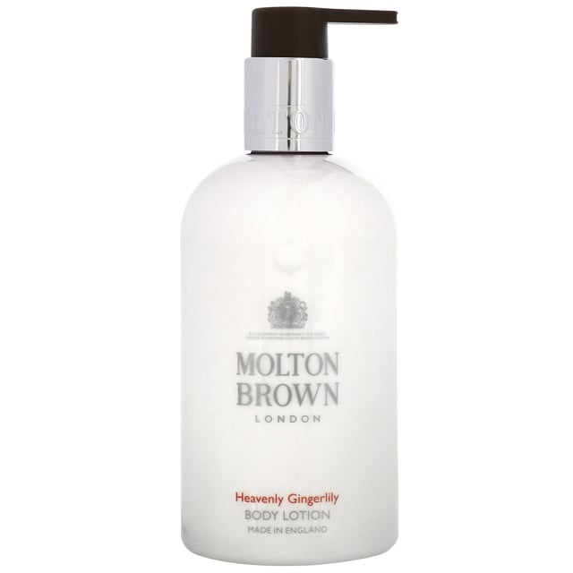 Indulge your skin with the luxurious Molton Brown Heavenly Gingerlily Body Lotion. This nourishing lotion opens with a warm blend of cardamom, ginger, and cloves, transitioning into enchanting floral notes of tuberose, tagetes, and lily. The fragrance culminates in a rich base of cedar, sandalwood, and musk, leaving your skin feeling soft and beautifully scented. Perfect for daily use, this cruelty-free lotion is Leaping Bunny approved, making it a responsible choice for your skincare routine.