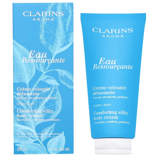 Indulge your skin with the Clarins Eau Ressourcante Comforting Silky Body Cream. This luxurious body cream offers rich nourishment while enveloping you in a soothing woody aroma. Infused with extracts of sarsaparilla, robinia, and longan, it enhances your skin's softness and provides a comforting finish. Perfect for daily use, simply apply to clean skin with gentle, sweeping motions to experience the ultimate pampering. Treat yourself to this delightful skincare essential and enjoy silky smooth skin all day long.