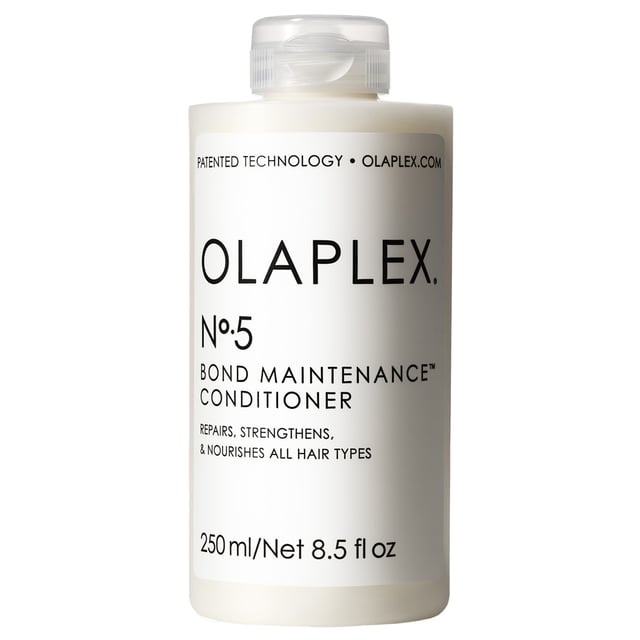 Discover the transformative power of Olaplex No 5 Bond Maintenance Conditioner, a deeply hydrating formula designed for all hair types. This reparative conditioner effortlessly detangles, enhances shine, and promotes healthier hair with every wash. It is color-safe and strengthens the hair's internal bonds, leaving your locks stronger and more manageable. Key benefits include repairing hair damage, boosting shine, and maintaining optimal pH balance (4.0-5.0). For best results, pair with Olaplex N°4 Bond Maintenance Shampoo. Simply apply a generous amount from scalp to tip, leave for three minutes, and rinse thoroughly. Ideal for daily use, this conditioner is rigorously tested for safety and efficacy, ensuring it is gentle on your hair and scalp.