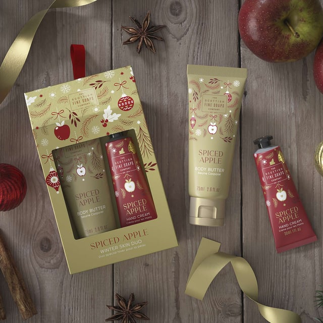 Indulge your skin this winter with the Scottish Fine Soaps Company Spiced Apple Winter Skin Care Duo. This luxurious set features a 30ml Spiced Apple Hand Cream and a 75ml Spiced Apple Body Butter, designed to deeply nourish and hydrate your skin during the cold months. Enjoy the delightful scent of spiced apples while keeping your skin soft and supple. Treat yourself or gift this perfect duo to someone special for a cozy winter skincare experience.