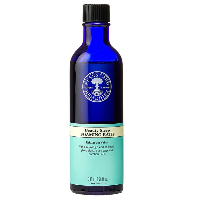 Transform your nighttime routine with Neal's Yard Remedies Beauty Sleep Foaming Bath. This luxurious bath is infused with essential oils like ylang ylang and clary sage, designed to calm your mind and body. Pour under warm running water, swirl to create foam, and immerse yourself in the tranquil aromas that promote relaxation and restful sleep. Made from 98% natural ingredients, this foaming bath ensures a gentle experience for your skin. Embrace Neal's Yard Remedies' commitment to sustainability and indulge in a serene soak for a peaceful night.