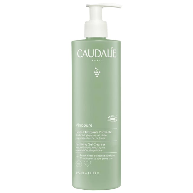 Transform your skincare routine with the Caudalie Vinopure Purifying Gel Cleanser, a powerful ally against blemishes. Enriched with natural salicylic acid, grapeseed polyphenols, and organic essential oils, it cleanses without stripping moisture. Its gentle formula tightens pores, controls oil, and reduces blemishes, leaving skin fresh. With 98% natural ingredients, this gel supports environmental conservation. Use morning and evening on damp skin, creating a light foam, and rinse off. Avoid the eye area for best results.
