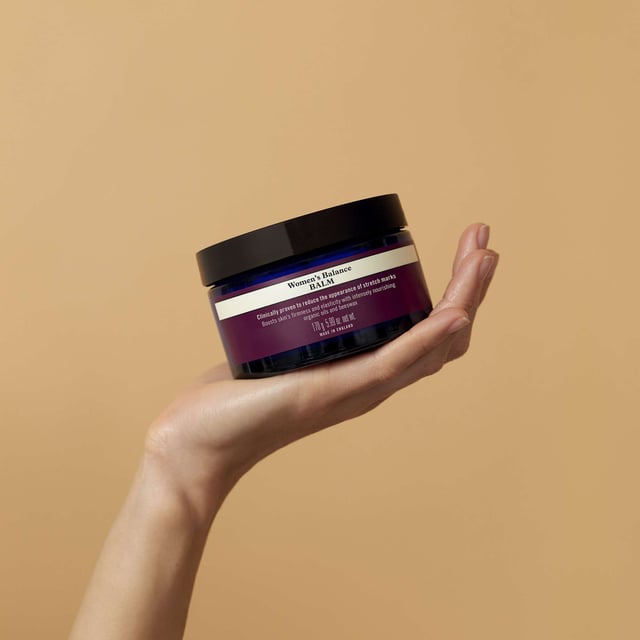 Discover the power of Neal's Yard Remedies Women's Balance Balm, a luxurious 170g aromatherapeutic balm designed to visibly reduce the appearance of stretch marks from growth spurts and weight changes. This clinically proven formula enhances skin firmness and elasticity, enriched with organic oils like sweet almond and macadamia oil. Experience deep nourishment while calming your mind with a soothing blend of patchouli, geranium, rose, and frankincense. Join the movement towards sustainable beauty with Neal's Yard Remedies, a pioneer in organic health and beauty since 1981.
