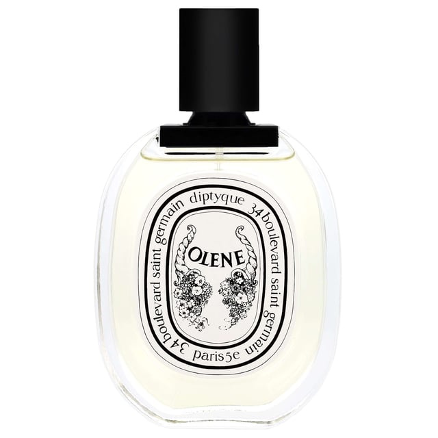 Diptyque Olene Eau de Toilette Spray - Enchanting Floral Fragrance Experience the allure of Venice with Diptyque Olene Eau de Toilette Spray. This captivating fragrance opens with delightful notes of narcissus and honeysuckle, transitioning into a lush heart of jasmine and wisteria. Finally, it concludes with a soft blend of white flowers and refreshing green notes, creating a romantic and enchanting scent perfect for any occasion. Indulge in the essence of a beautiful evening with every spray.